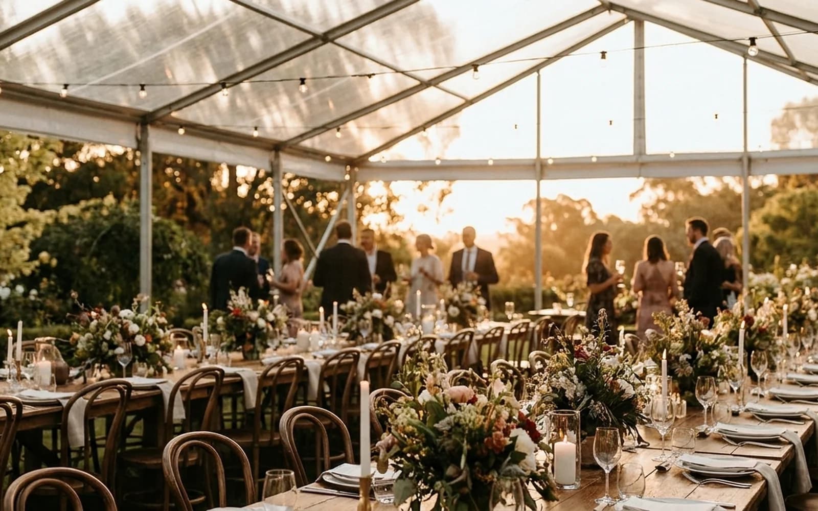 A styled clear-roof marquee event in the Adelaide Hills at golden hour